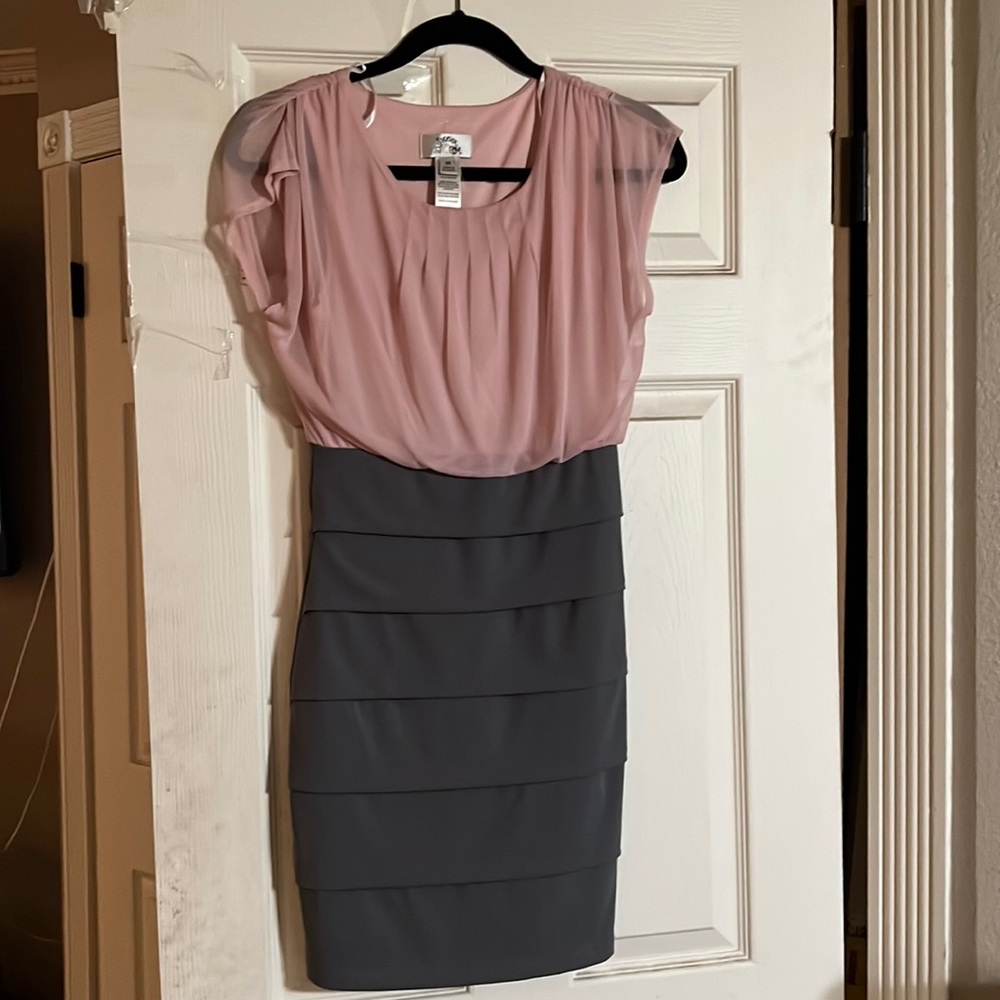 Selling a skin tight medium dress by sweet storm color pink and gray